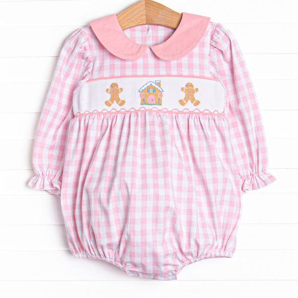  This bubble features a pink check print, a pink peter pan collar, and a ginger snap smocking. 
