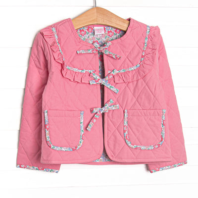  This jacket features pink fabric on one side, floral trim, a tie front, and front pockets. 