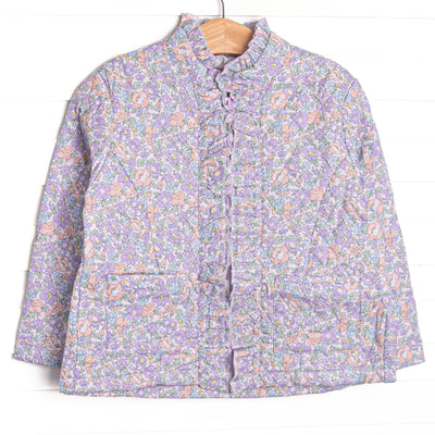 Quilted details, a full-length zipper for easy use, purple floral print, and front pockets to keep little hands warm.