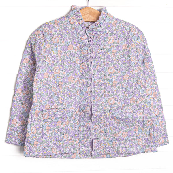 Quilted details, a full-length zipper for easy use, purple floral print, and front pockets to keep little hands warm.