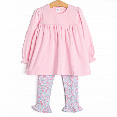 This set features a pink ruffle top with coordinating pink floral leggings to match.