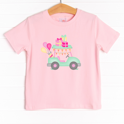 he shirt is featured in four colors; White, Heather Gray, Ballerina Pink, and Soft Blue with a festive graphic. 