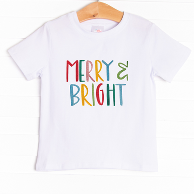 he tee is featured in four colors: Heather Gray, Soft Blue, Ballerina Pink, and White. 