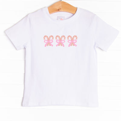 The tee is featured in four colors: Heather Gray, Soft Blue, , Ballerina Pink, and White.