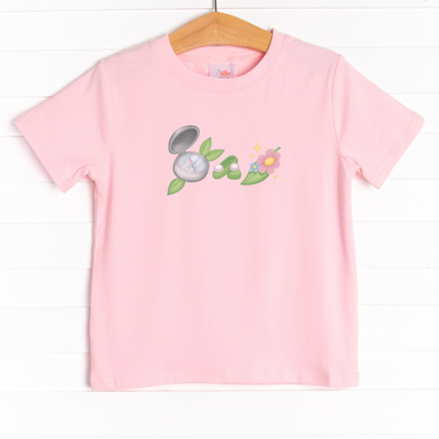  The tee is featured in four colors: Ballerina Pink, White, Heather Gray, and Soft Blue. 