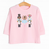  Our Holiday at the Ballet Graphic Tee features the cutest ballerina and nutcrackers graphic in the center. 