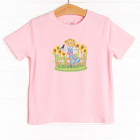 This shirt features four colors: Ballerina Pink, Soft Blue, White, and Heather Gray with a scarecrow graphic