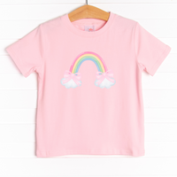 The shirt is featured in four colors; White, Heather Gray, Ballerina Pink, and Soft Blue with an rainbow and pink bow graphic.