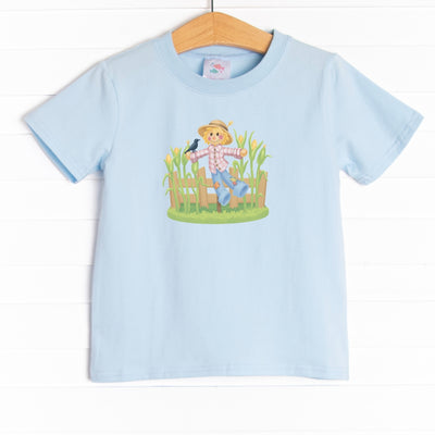  This shirt features three colors: Soft Blue, White, and Heather Gray with a scarecrow graphic. 