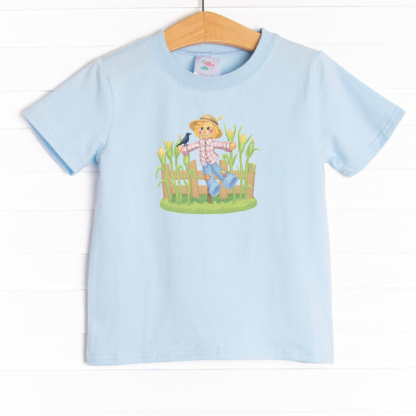  This shirt features three colors: Soft Blue, White, and Heather Gray with a scarecrow graphic. 