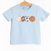 &nbsp;This shirt is featured in four colors: White, Heather Gray, Ballerina Pink, and Soft Blue with a sports ball graphic. 