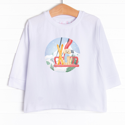  This long sleeve tee is featured in 3 colors: White, Heather Gray, and Soft Blue with a skiing puppy graphic. 