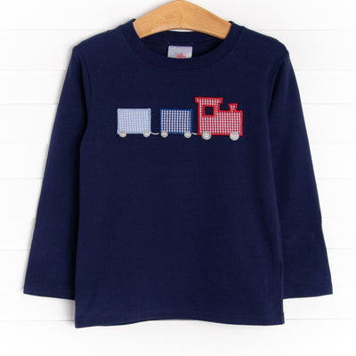 A long sleeve knit top in navy with three train applique. 