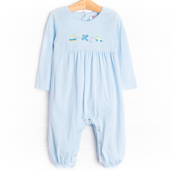 This romper features light blue knit material, snaps on the strides, and the cutest train, airplane and car embroidery.
