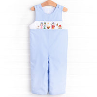  The Jon Jon featured in blue gingham boasts fabric buttons, snaps in the stride to make changing a breeze, and a smocked Christmas scene. 