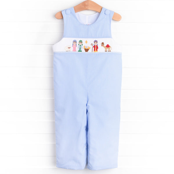  The Jon Jon featured in blue gingham boasts fabric buttons, snaps in the stride to make changing a breeze, and a smocked Christmas scene. 