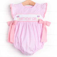 This bubble will make your little one feel special on their big day! This bubble is featured in pink gingham with flutter sleeves, festive smocking, and the cutest ties on the sides.&nbsp;